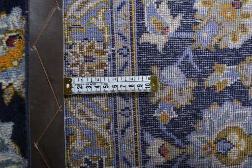 Close-up detail of 2000s Kashan rug from Iran / Persia showing Wool weave