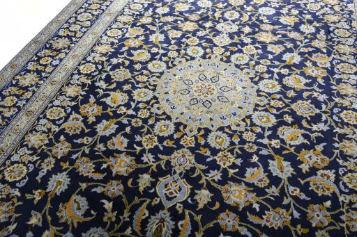 Backside of handmade 2000s Kashan rug showing knot structure and weave density