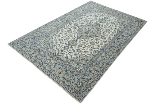 Corner detail of 2000s Kashan rug showing border pattern and Wool pile