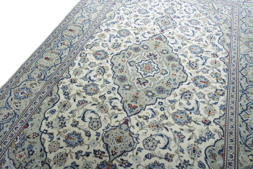 Backside of handmade 2000s Kashan rug showing knot structure and weave density