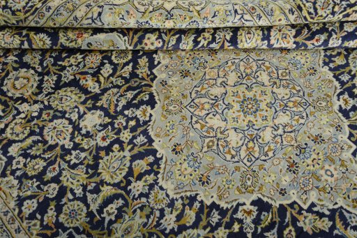 Surface texture of 2000s Kashan rug with natural Wool and intricate pattern