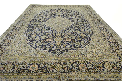 Surface texture of 2000s Kashan rug with natural Wool and intricate pattern