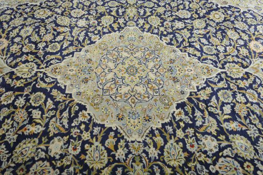 Central medallion detail of 2000s Kashan rug from Iran / Persia