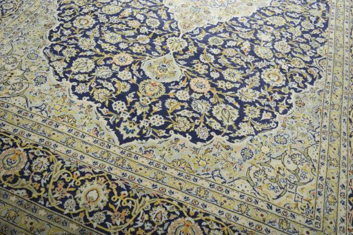 Close-up detail of 2000s Kashan rug from Iran / Persia showing Wool weave