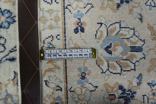 Backside of handmade 2000s Kashan rug showing knot structure and weave density