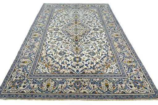 Backside of handmade 2000s Kashan rug showing knot structure and weave density