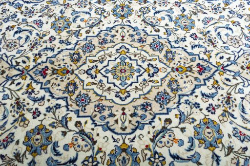 Close-up detail of 2000s Kashan rug from Iran / Persia showing Wool weave