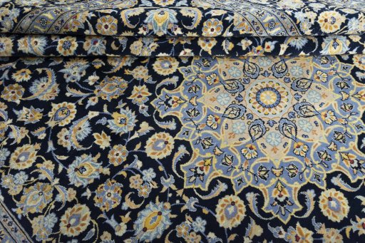 Close-up detail of 2000s Kashan rug from Iran / Persia showing Wool weave