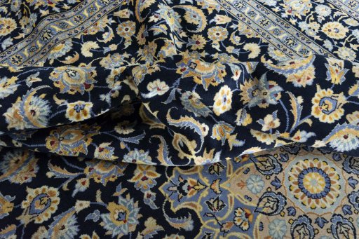 Surface texture of 2000s Kashan rug with natural Wool and intricate pattern