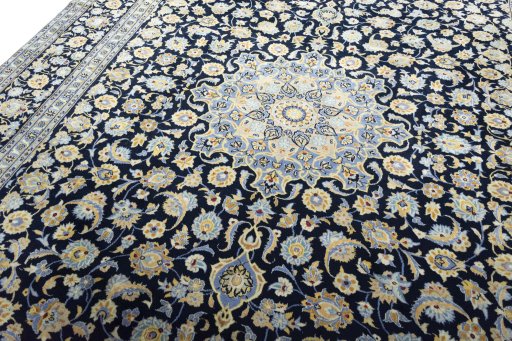 Backside of handmade 2000s Kashan rug showing knot structure and weave density