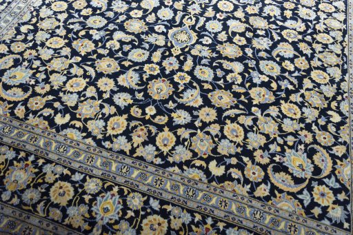 Close-up detail of 2000s Kashan rug from Iran / Persia showing Wool weave