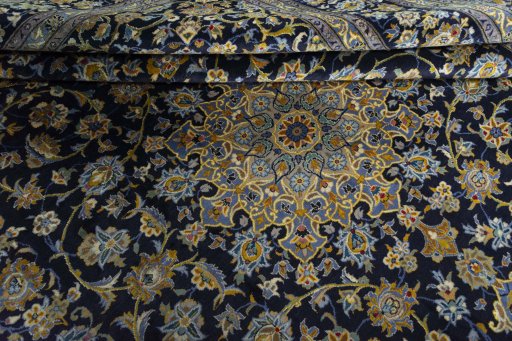 Close-up detail of 2000s Kashan rug from Iran / Persia showing Wool weave