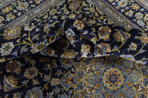 Surface texture of 2000s Kashan rug with natural Wool and intricate pattern
