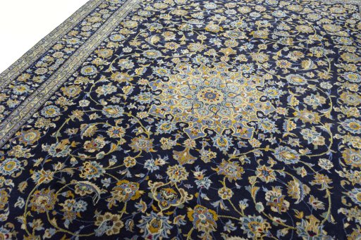 Backside of handmade 2000s Kashan rug showing knot structure and weave density