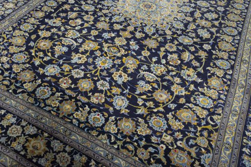 Close-up detail of 2000s Kashan rug from Iran / Persia showing Wool weave