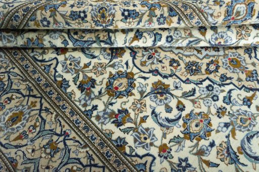 Close-up detail of 2000s Kashan rug from Iran / Persia showing Wool weave