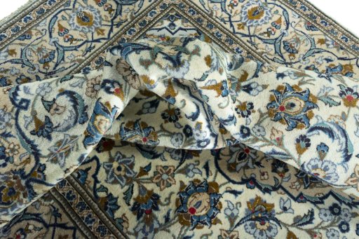 Surface texture of 2000s Kashan rug with natural Wool and intricate pattern