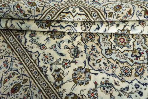 Close-up detail of 2000s Kashan rug from Iran / Persia showing Wool weave