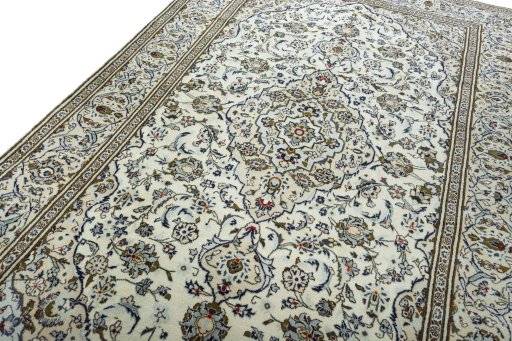 Backside of handmade 2000s Kashan rug showing knot structure and weave density