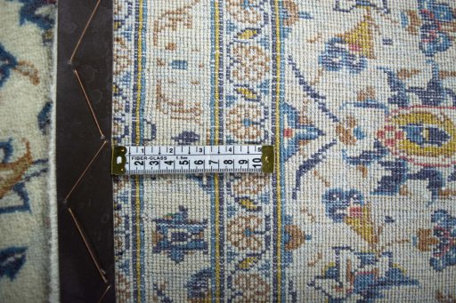 Surface texture of 2000s Kashan rug with natural Wool and intricate pattern