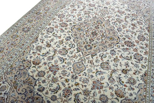 Backside of handmade 2000s Kashan rug showing knot structure and weave density