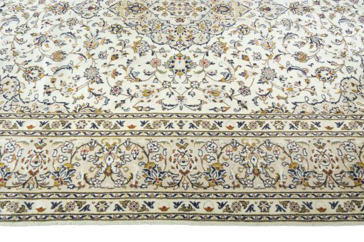 Corner detail of 2000s Kashan rug showing border pattern and Wool pile