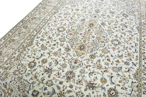 Backside of handmade 2000s Kashan rug showing knot structure and weave density