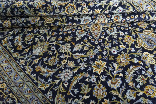 Close-up detail of 2000s Kashan rug from Iran / Persia showing Wool weave