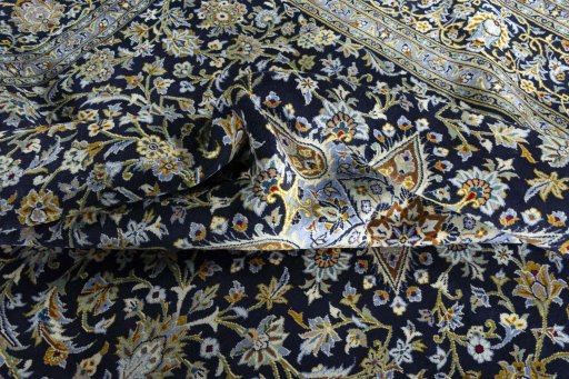 Surface texture of 2000s Kashan rug with natural Wool and intricate pattern