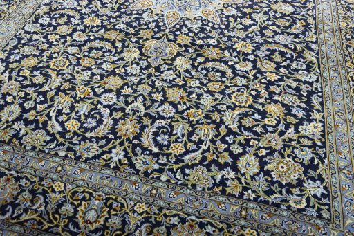 Close-up detail of 2000s Kashan rug from Iran / Persia showing Wool weave