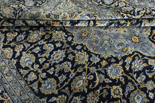 Close-up detail of 2000s Kashan rug from Iran / Persia showing Wool weave