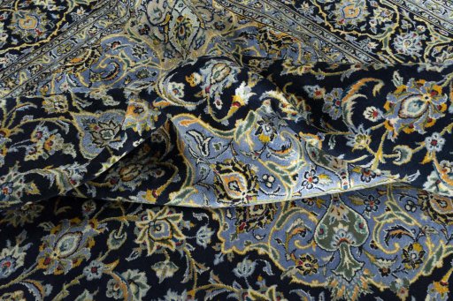 Surface texture of 2000s Kashan rug with natural Wool and intricate pattern