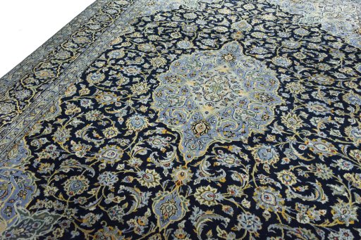 Backside of handmade 2000s Kashan rug showing knot structure and weave density