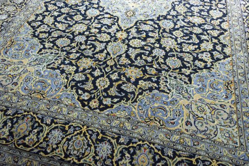 Close-up detail of 2000s Kashan rug from Iran / Persia showing Wool weave