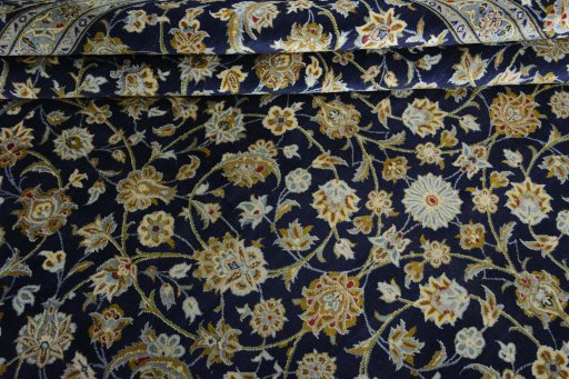Close-up detail of 2000s Kashan rug from Iran / Persia showing Wool weave