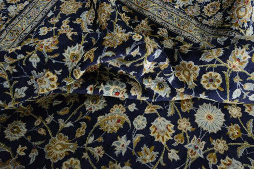Surface texture of 2000s Kashan rug with natural Wool and intricate pattern