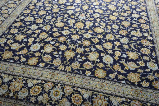 Close-up detail of 2000s Kashan rug from Iran / Persia showing Wool weave