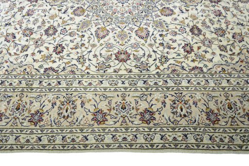 Corner detail of 2000s Kashan rug showing border pattern and Wool pile