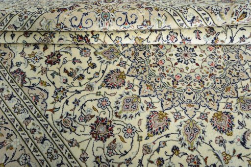 Close-up detail of 2000s Kashan rug from Iran / Persia showing Wool weave