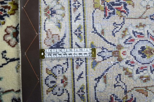 Backside of handmade 2000s Kashan rug showing knot structure and weave density