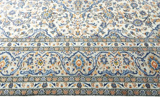 Corner detail of 2000s Kashan rug showing border pattern and Wool pile