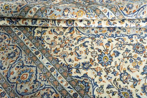 Close-up detail of 2000s Kashan rug from Iran / Persia showing Wool weave
