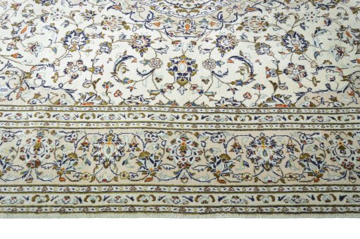 Corner detail of New Kashan rug showing border pattern and Wool pile