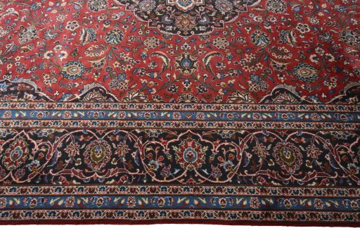 Corner detail of 2000s Kashan rug showing border pattern and Wool pile