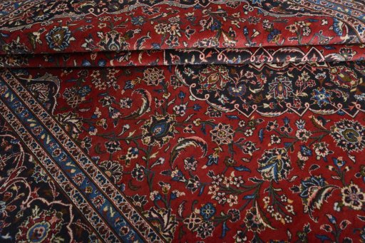 Close-up detail of 2000s Kashan rug from Iran / Persia showing Wool weave