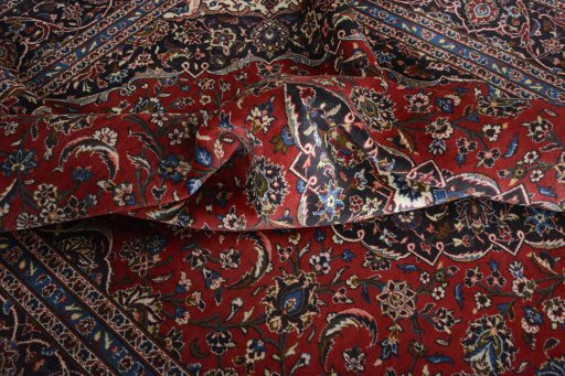 Surface texture of 2000s Kashan rug with natural Wool and intricate pattern