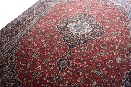 Backside of handmade 2000s Kashan rug showing knot structure and weave density