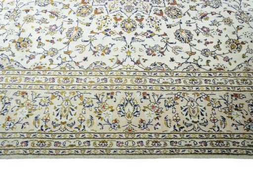 Corner detail of New Kashan rug showing border pattern and Wool pile