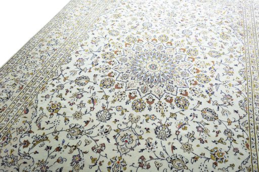 Backside of handmade New Kashan rug showing knot structure and weave density