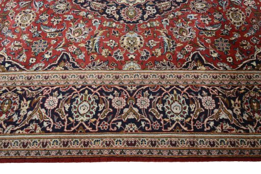 Corner detail of 2000s Kashan rug showing border pattern and Wool pile